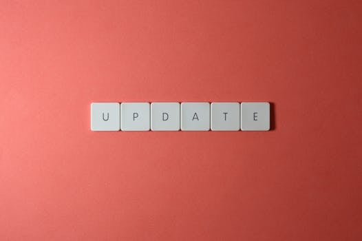 pexels-photo-2882668-2882668 Keyboard keys arranged to spell 'update' on a vibrant red background, ideal for conveying tech concepts.